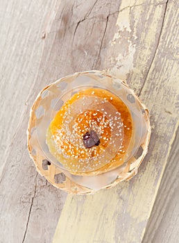 Homemade bread in basket on wooden table, Topview