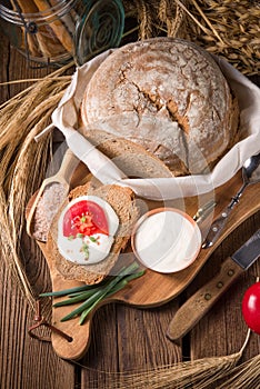 Homemade bread with cream and tomato