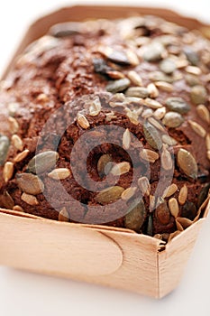 Homemade bread with grains in a box