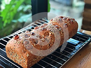 Homemade bread and knife on black tray with Natural light . Healthy bread.