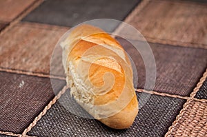 Homemade bread and knife on the kitchen table.Tasty food