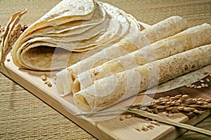 Homemade bread pita, puri, chapati, lavash bread on old wooden