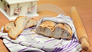 Homemade bread, rolling pin, two bread slices, beautiful decoupage box.