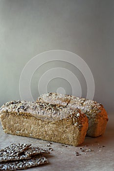 Homemade bread with seeds on a white background