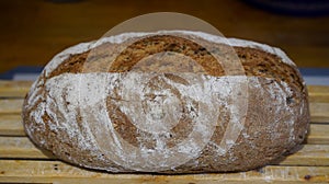 Homemade bread taken out of the oven and left to rest. Indoor photography. Product photography.