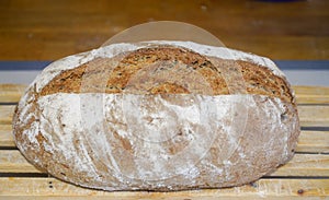 Homemade bread taken out of the oven and left to rest. Indoor photography. Product photography.