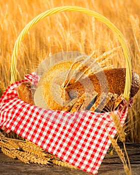 Homemade bread and wheat on the wooden table