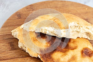 Homemade Bread On The Wooden Board Above Blue Background