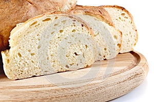 Homemade bread on wooden breadboard