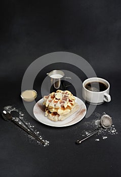 Homemade of Breakfast tasty Waffles, Caramel Sauce, Coffee Cup, Milk, dessertspoon, strainer