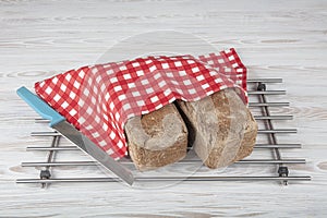 Homemade buckwheat bread. Gluten-free bread. Freshly baked traditional bread on wooden table. Rustic bread with buckwheat. Organic