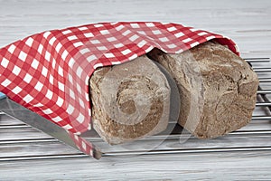 Homemade buckwheat bread. Gluten-free bread. Freshly baked traditional bread on wooden table. Rustic bread with buckwheat. Organic