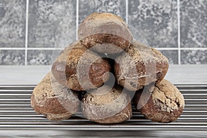 Homemade buckwheat bread. Gluten-free bread. Freshly baked traditional bread on wooden table. Rustic bread with buckwheat. Organic