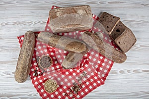 Homemade buckwheat bread. Gluten-free bread. Freshly baked traditional bread on wooden table. Rustic bread with buckwheat. Organic