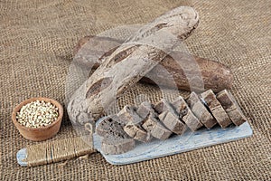 Homemade buckwheat bread. Gluten-free bread. Freshly baked traditional bread on wooden table. Rustic bread with buckwheat. Organic