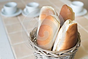 Homemade buns in a basket on the table