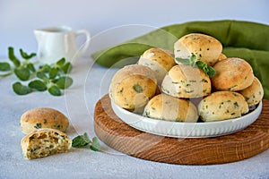 Homemade buns with fresh zaatar, oregano leaves