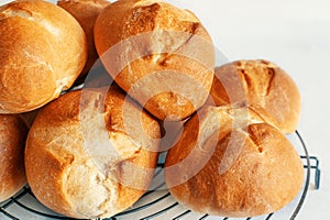 homemade buns. Homemade buns on wood board with wheat ears. Homemade Dinner Rolls, selective focus