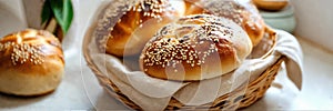 homemade buns with sesame seeds in a basket. Selective focus.