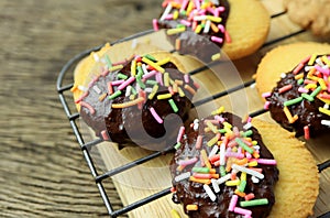 homemade butter cookies dipped in chocolate and sugar sprinkle.