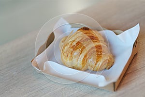 Homemade butter croissants in paper plates