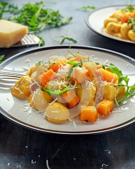 Homemade Butternut squash gnocchi with wild rocket and parmesan cheese