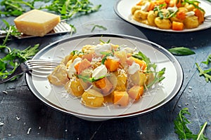 Homemade Butternut squash gnocchi with wild rocket and parmesan, ricotta cheese