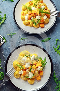 Homemade Butternut squash gnocchi with wild rocket and parmesan, ricotta cheese