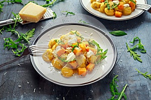 Homemade Butternut squash gnocchi with wild rocket and parmesan, ricotta cheese