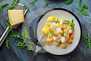 Homemade Butternut squash gnocchi with wild rocket and parmesan, ricotta cheese