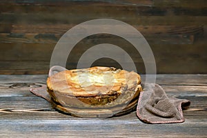 Homemade cabbage vegetable pie, tart on wooden rustic table. cooking baking pastry receipe. Autumn winter vegetarian