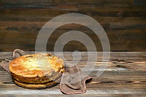 Homemade cabbage vegetable pie, tart on wooden rustic table. cooking baking pastry receipe. Autumn winter vegetarian vegan food