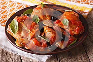 Homemade Cacciatori chicken on a plate close-up. horizontal photo