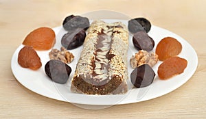 Homemade cake dessert on the white plate on the brown wooden table