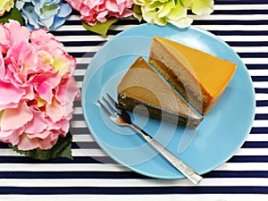 Homemade cake on dish with spring flower and space copy background