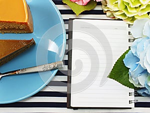 Homemade cake on dish with spring flower and space copy background