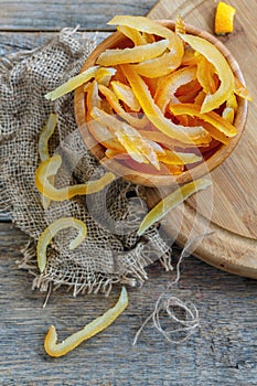 Homemade candied citrus fruit in a wooden bowl. photo
