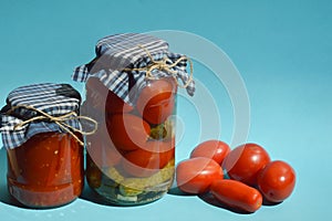 homemade canned blanks. pickled tomatoes and cucumbers, snacks, canned vegetables. background for the design.