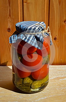 homemade canned blanks. pickled tomatoes and cucumbers, snacks, canned vegetables. background for the design.
