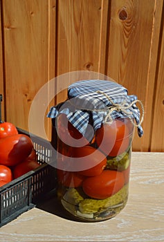 homemade canned blanks. pickled tomatoes and cucumbers, snacks, canned vegetables. background for the design.