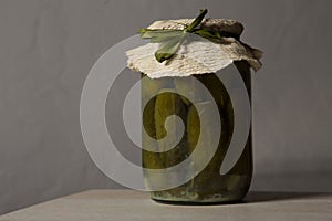 homemade canned cucumbers in small glass jar
