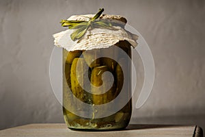 homemade canned cucumbers in small glass jar