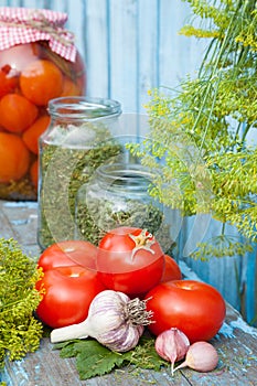 Homemade canned tomatoes in glass jar. Fresh vegetables