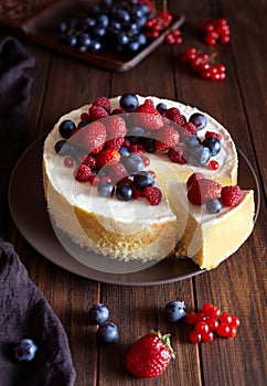 Homemade cheese cake with strawberry and winter berries. New York Cheesecake. Christmas dessert. Healthy food.