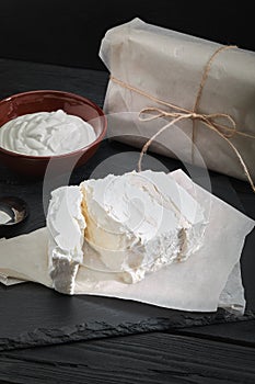 Homemade cheese, milk and cottage cheese on a wooden background. rustic style. Set of dairy products, assortment of milk