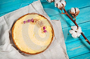 Homemade cheesecake - healthy organic summer dessert pie cheesecake. Cheese cake on blue wood table.