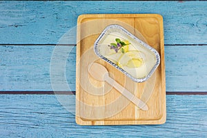 Homemade cheesecake with topping Durian fruit on a blue wood background