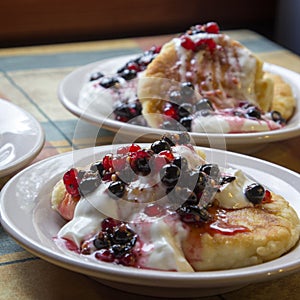 Homemade cheesecakes with sour cream and red and black currant s