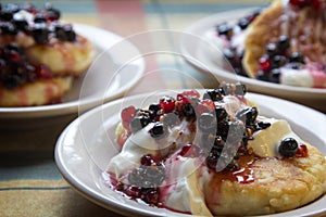 Homemade cheesecakes with sour cream and red and black currant s