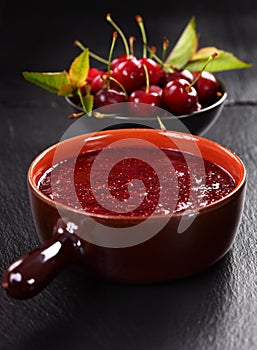 Homemade cherry jam with wild strawberries